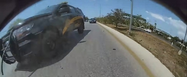 Police truck crashing into a Tesla Model S Plaid
