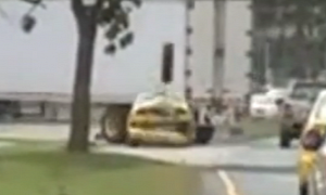 Watch a Taxi Get Hit by a Truck Tire