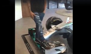 Watch All of Hamilton's 150 Lbs Prove Just How Tough an F1 Car's Front Wing Is
