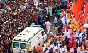 Watch an Ambulance Split a Huge Crowd in India as If Moses Was Driving