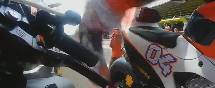 Andrea Dovizioso jumping between bikes