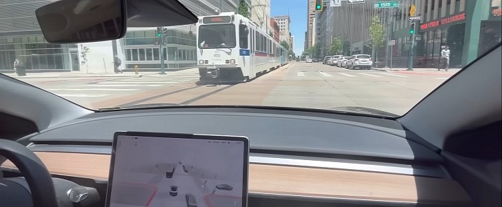 Tesla Model 3 on FSD Beta trying to turn directly in front of a train