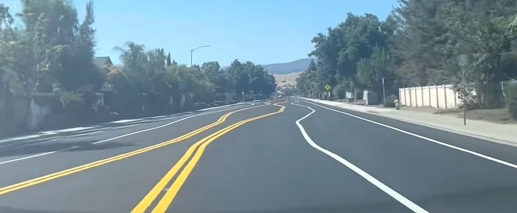 Tesla with FSD navigates road with crooked lane markings like a pro