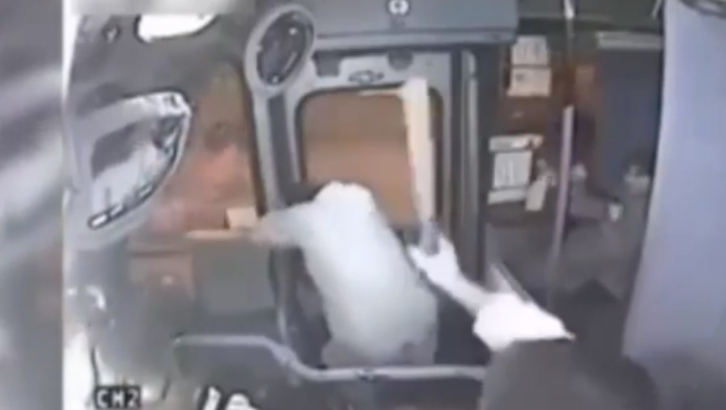 The bus driver kept hitting the man with a bat