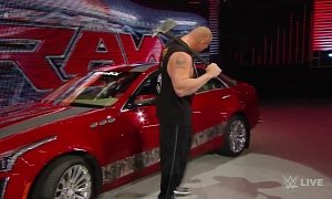 Watch Wrestler Brock Lesnar Destroying a 2015 Cadillac CTS with an Axe