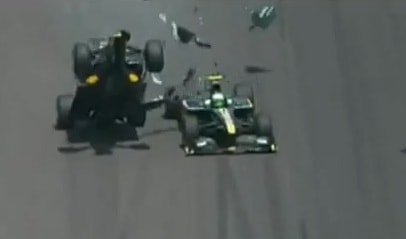 Mark Webber's car flies into the air after making contact with Heikki Kovalainen's Lotus