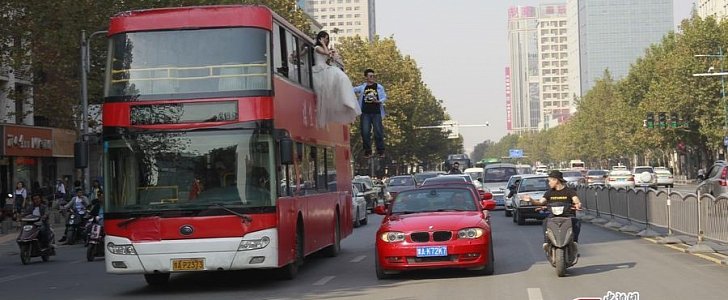Wedded Couple Levitating Off the Side of a Double-Decker Steals the Show in China 