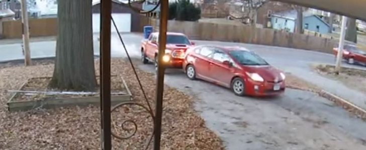 Woman smashes into husband's stationary car, right in their driveway