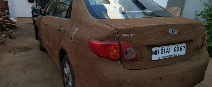 Woman smears cow dung on Toyota Corolla to keep cool