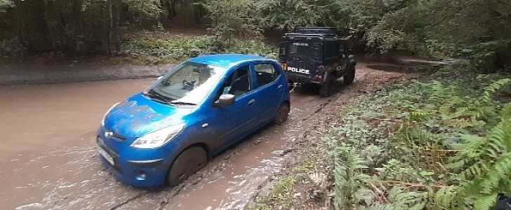 The car got stuck in the water on an off-road route