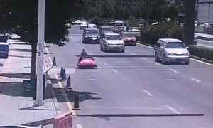 Woman Drives Pink Bumper Car on Busy Street, Is Unpredictably Pulled Over
