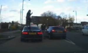 Woman Gets Piggyback Ride on Top of BMW 3 Series Coupe
