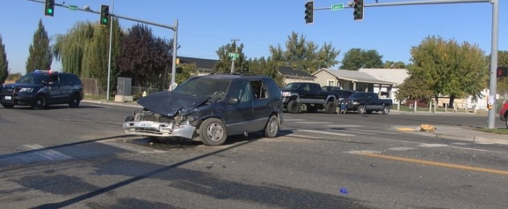 Woman runs red light, hits another car, is then run over by her own vehicle