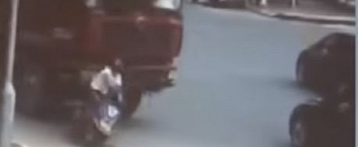 Female on her moped is knocked down by truck, ran over
