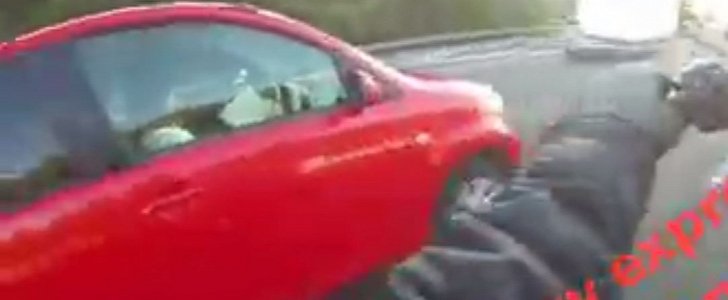 Biker is shocked to see driver reading a book while speeding down NZ highway