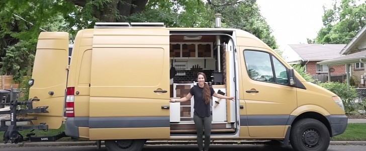 This beautiful camper van features a rustic-modern interior filled with amenities