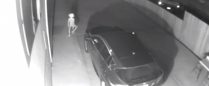 Alien caught by CCTV wandering in woman's driveway