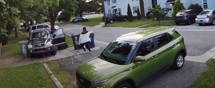Woman falls out of her own car as she's backing out of parking spot