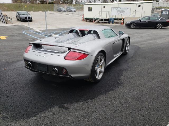 photo of Would You Buy This Damaged Porsche Carrera GT Supercar for $400,000? image