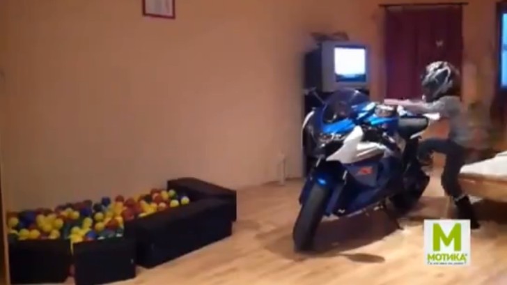 Young Girl Revving Up a Suzuki GSX Indoors