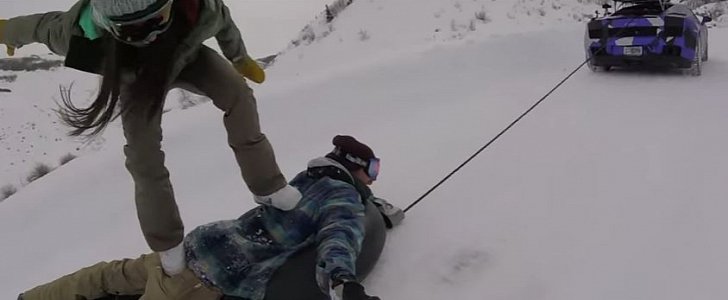 Lamborghini pulling a human snowboard