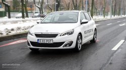 2015 PEUGEOT 308 driving in the city